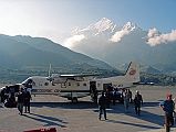 10 Deplaning At Jomsom Airport With Nilgiri North Behind 